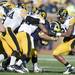 Michigan running back Thomas Rawls is swarmed by Iowa defenders during the third quarter at Michigan Stadium. Melanie Maxwell I AnnArbor.com